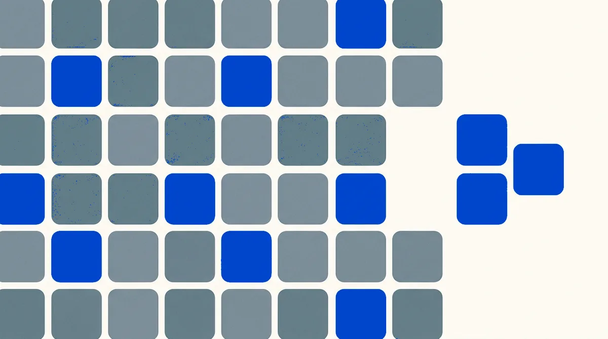 An orderly grid of rounded tiles with three tiles lifted out and set aside